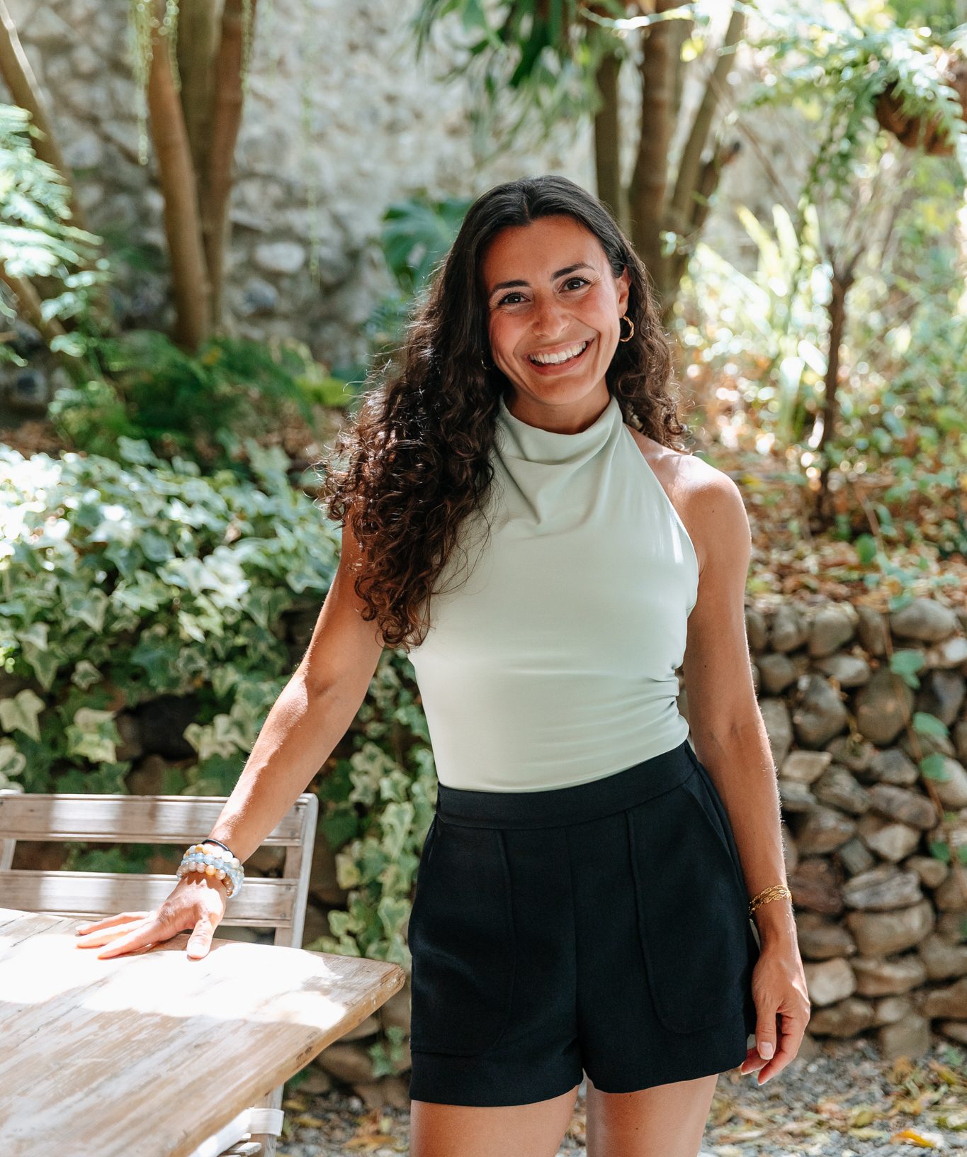 Woman bent backwards in midst if yoga pose.